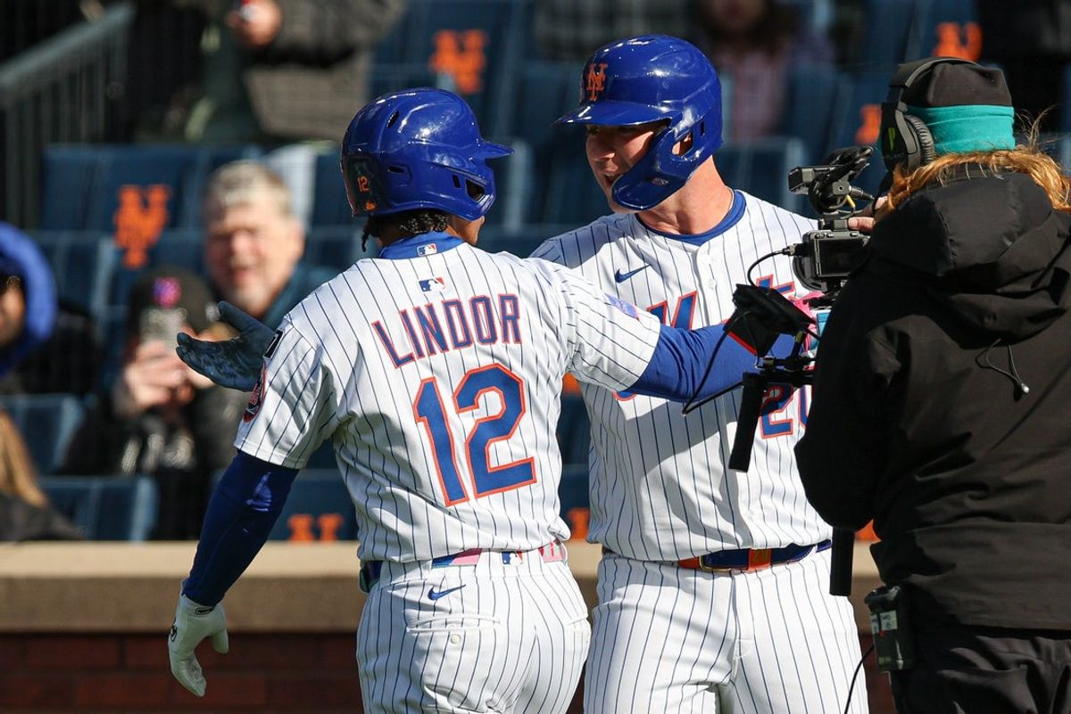 Apr 8, 2025; New York City, New York, USA; New York Mets shortstop Francisco Lindor (12) celebrates with first baseman Pete Alonso (20) after hitting a solo home run during the first inning against the Miami Marlins at Citi Field. Mandatory Credit: Vincent Carchietta-Imagn Images