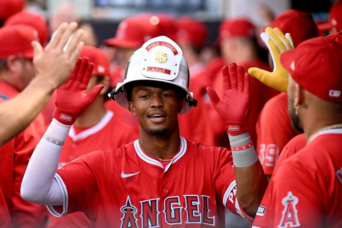 Apr 8, 2025; Tampa, Fla., USA; Los Angeles Angels second baseman Kyren Paris (19) celebrates with his teammates  after hitting a two run home run in the second inning against the Tampa Bay Rays at George M. Steinbrenner Field. Mandatory Credit: Jonathan Dyer-Imagn Images