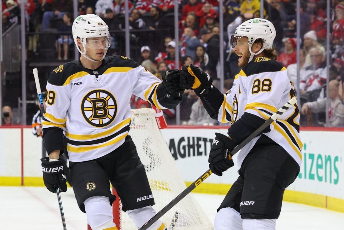 Apr 8, 2025; Newark, New Jersey, USA; Boston Bruins right wing David Pastrnak (88) celebrates his goal against the New Jersey Devils during the first period at Prudential Center. Mandatory Credit: Ed Mulholland-Imagn Images