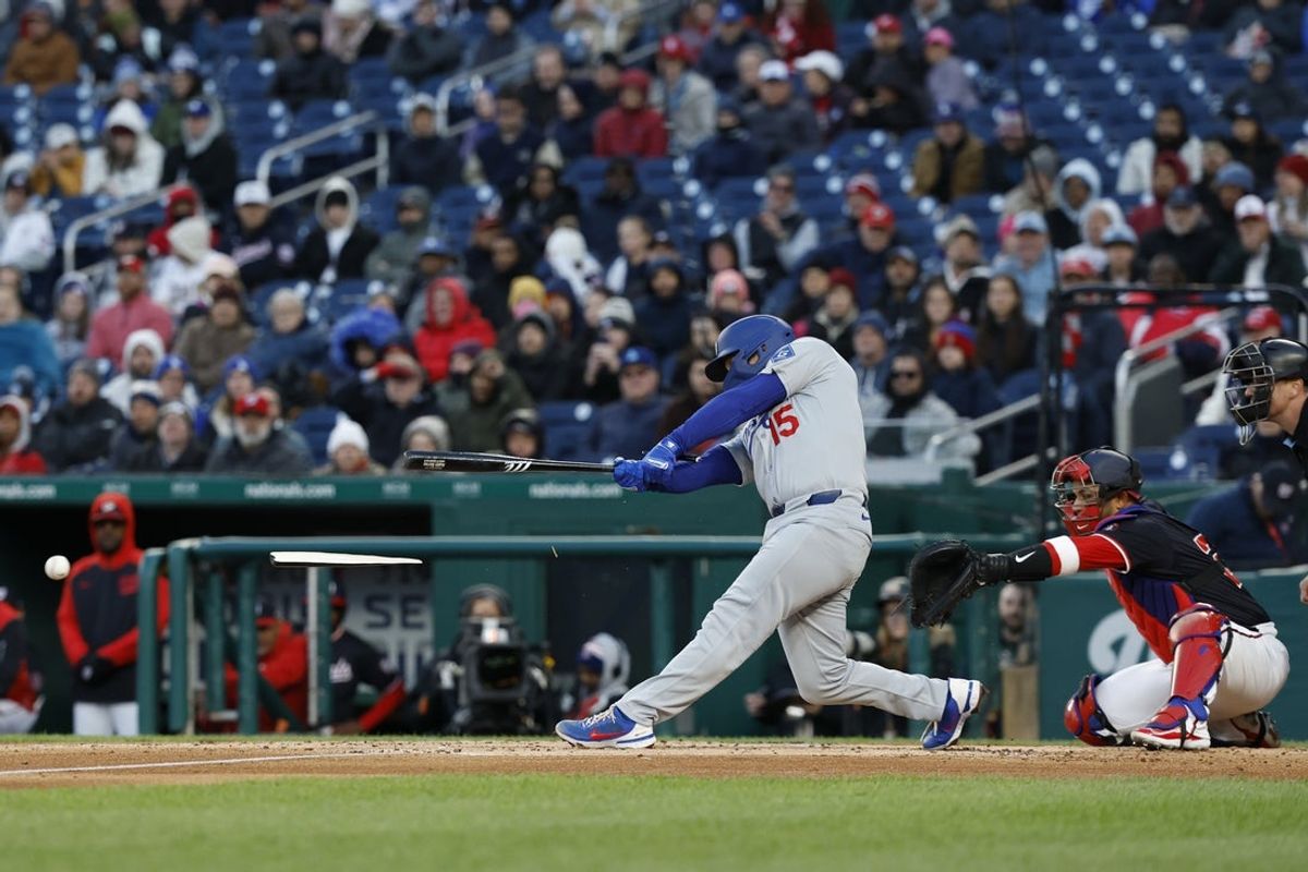 Apr 8, 2025; Washington, District of Columbia, USA; Los Angeles Dodgers catcher Austin Barnes (15) breaks his bat hitting a ground ball against the Washington Nationals during the second inning at Nationals Park. Mandatory Credit: Geoff Burke-Imagn Images