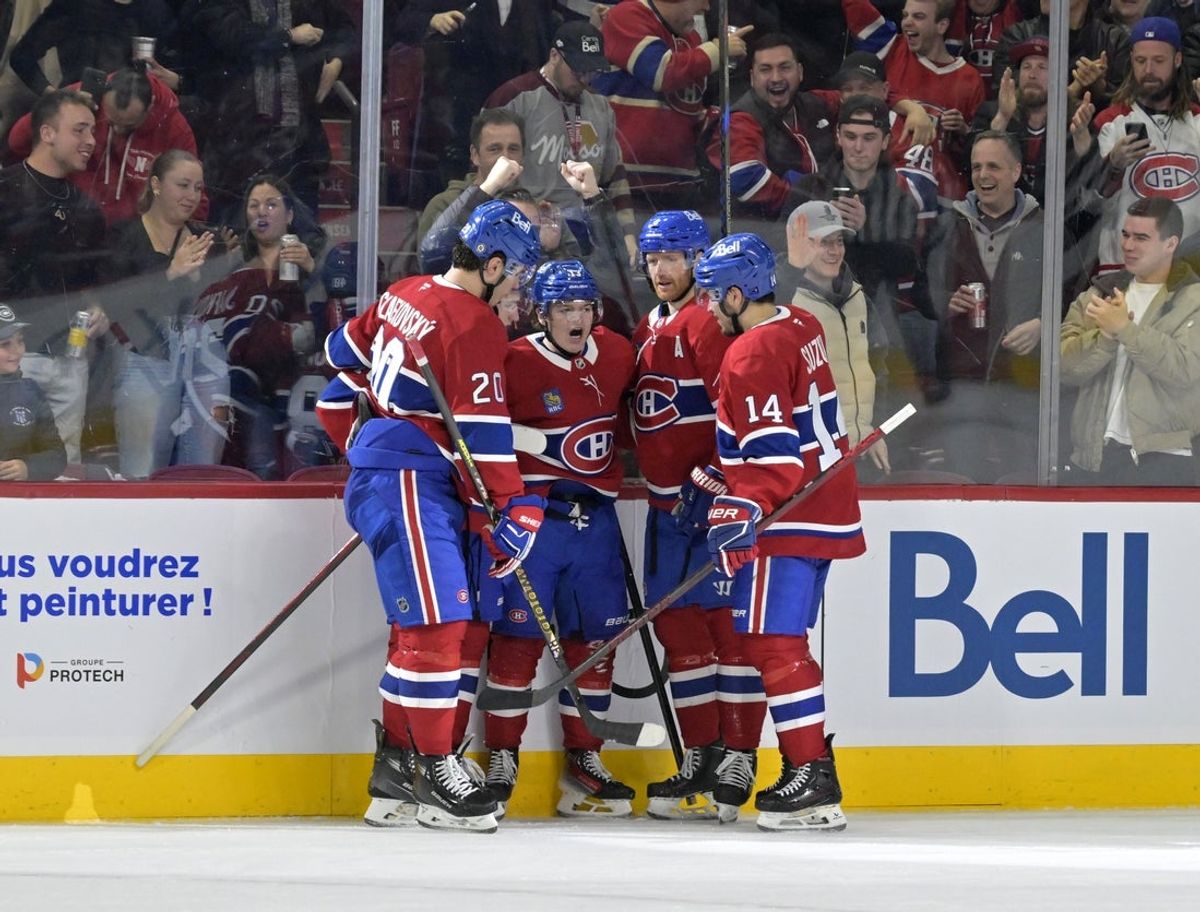 Apr 8, 2025; Montreal, Quebec, CAN; Montreal Canadiens forward Cole Caufield (13) celebrates with teammates after scoring a goal against the Detroit Red Wings during the second period at the Bell Centre. Mandatory Credit: Eric Bolte-Imagn Images