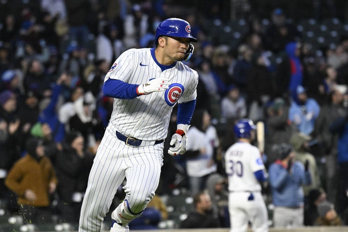 Apr 8, 2025; Chicago, Illinois, USA;  Chicago Cubs outfielder Seiya Suzuki (27) runs after he hit a two RBI single against the Texas Rangers during the second inning at Wrigley Field. Mandatory Credit: Matt Marton-Imagn Images