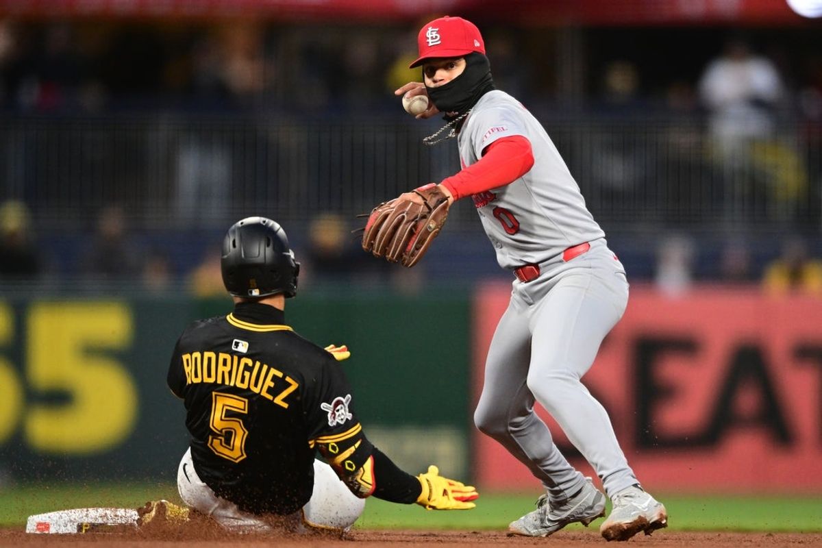Apr 8, 2025; Pittsburgh, Pennsylvania, USA; St. Louis Cardinals shortstop Masyn Winn (0) throws to first base for a double play after firing out Pittsburgh Pirates catcher Endy Rodriguez (5) at second base during the fifth inning at PNC Park. Mandatory Credit: David Dermer-Imagn Images