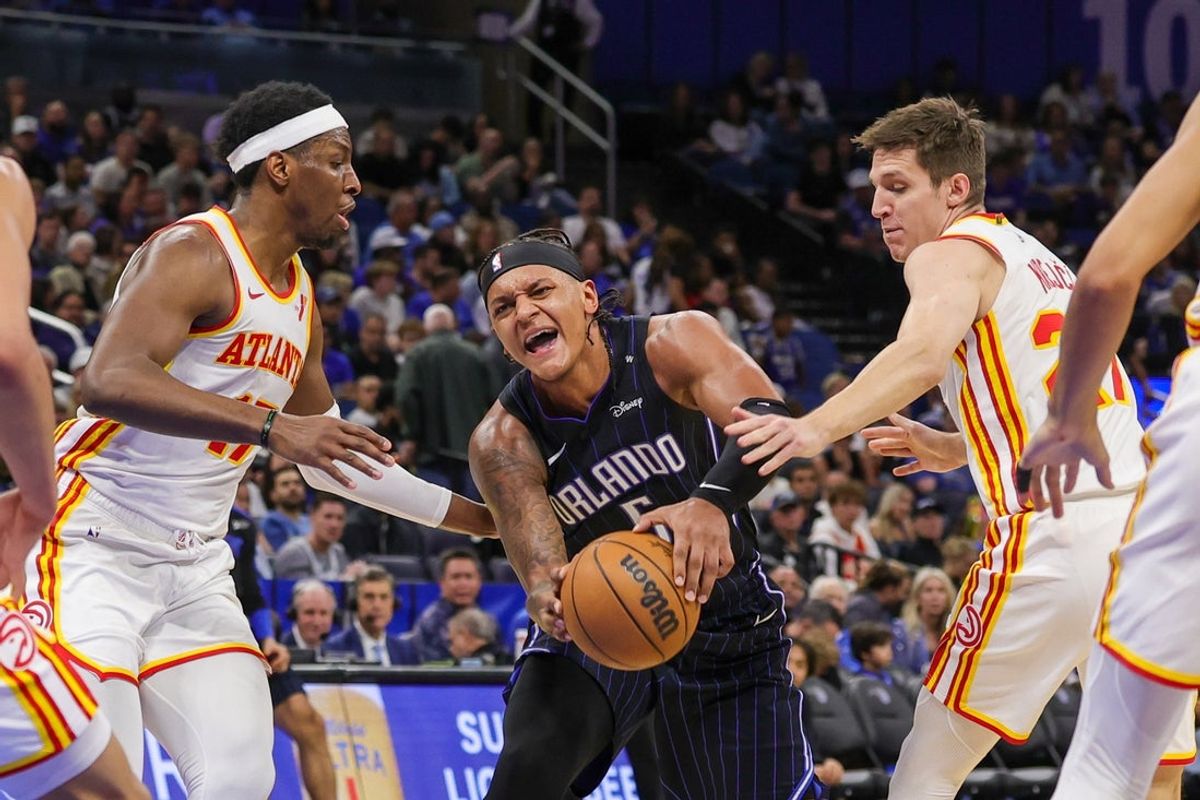Apr 8, 2025; Orlando, Florida, USA; Orlando Magic forward Paolo Banchero (5) is fouled by Atlanta Hawks guard Vit Krejci (27) during the second half at Kia Center. Mandatory Credit: Mike Watters-Imagn Images
