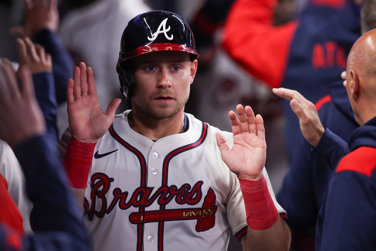 Apr 8, 2025; Atlanta, Georgia, USA; Atlanta Braves left fielder Jarred Kelenic (24) celebrates with teammates after scoring a run against the Philadelphia Phillies in the sixth inning at Truist Park. Mandatory Credit: Brett Davis-Imagn Images