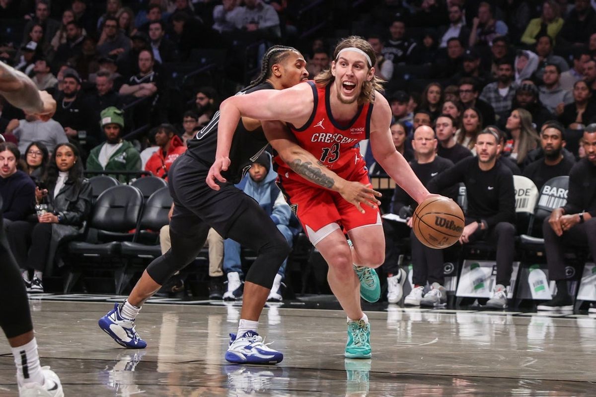 Apr 8, 2025; Brooklyn, New York, USA;  New Orleans Pelicans forward Kelly Olynyk (13) looks to drive past Brooklyn Nets guard Tyson Etienne (10) in the third quarter at Barclays Center. Mandatory Credit: Wendell Cruz-Imagn Images