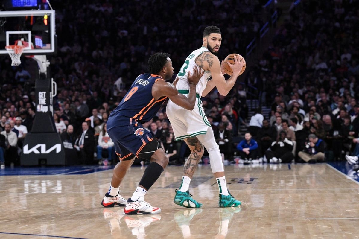 Apr 8, 2025; New York, New York, USA; Boston Celtics forward Jayson Tatum (0) sets the play while being defended by New York Knicks forward OG Anunoby (8) during the second half at Madison Square Garden. Mandatory Credit: John Jones-Imagn Images