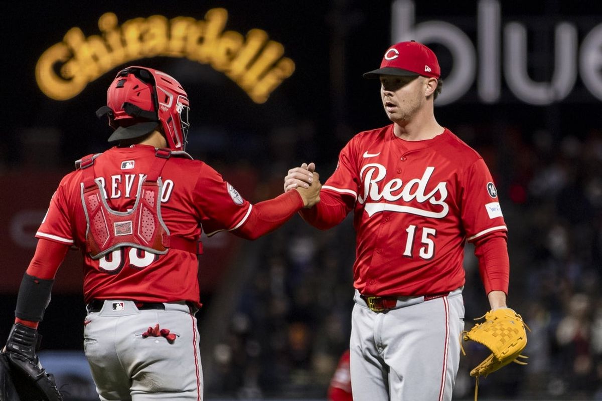 Apr 8, 2025; San Francisco, California, USA;  Cincinnati Reds catcher Jose Trevino (35) and closing pitcher Emilio Pagán (15) celebrate their team’s win over the San Francisco Giants at Oracle Park. Mandatory Credit: John Hefti-Imagn Images