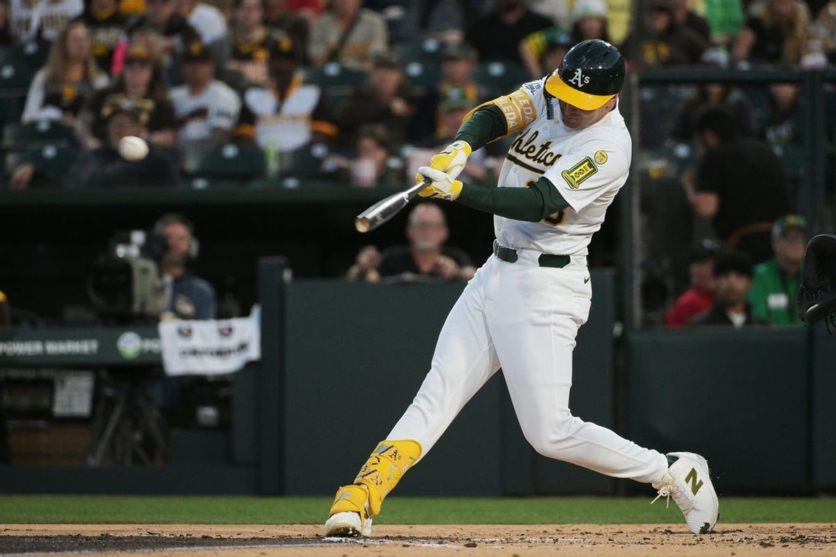 Apr 8, 2025; West Sacramento, California, USA; Athletics outfielder JJ Bleday (33) hits an RBI double against the San Diego Padres during the first inning at Sutter Health Park. Mandatory Credit: Ed Szczepanski-Imagn Images