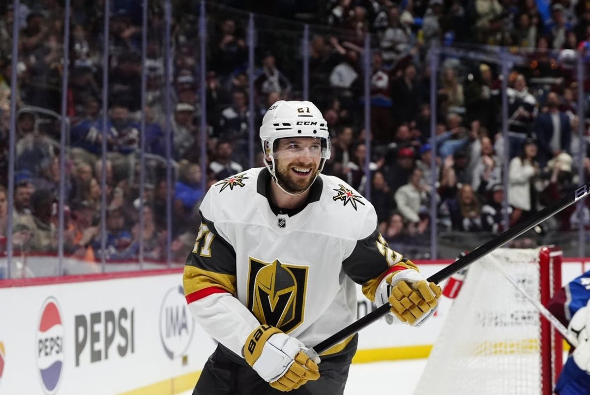 Apr 8, 2025; Denver, Colorado, USA; Vegas Golden Knights center Brett Howden (21) reacts during a shootout against the Colorado Avalanche at Ball Arena. Mandatory Credit: Ron Chenoy-Imagn Images