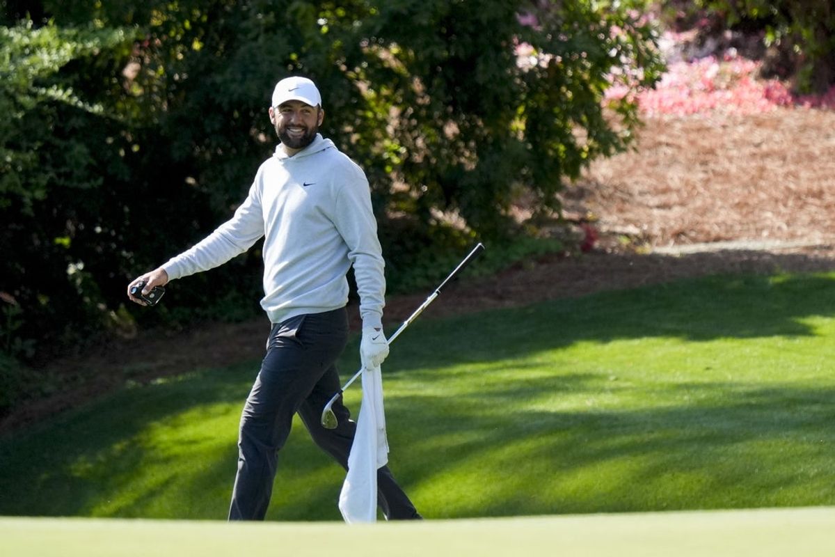 Apr 9, 2025; Augusta, Georgia, USA; Scottie Scheffler walks the no. 13 green during a practice round for the Masters Tournament at Augusta National Golf Club. Mandatory Credit: Katie Goodale-Imagn Images