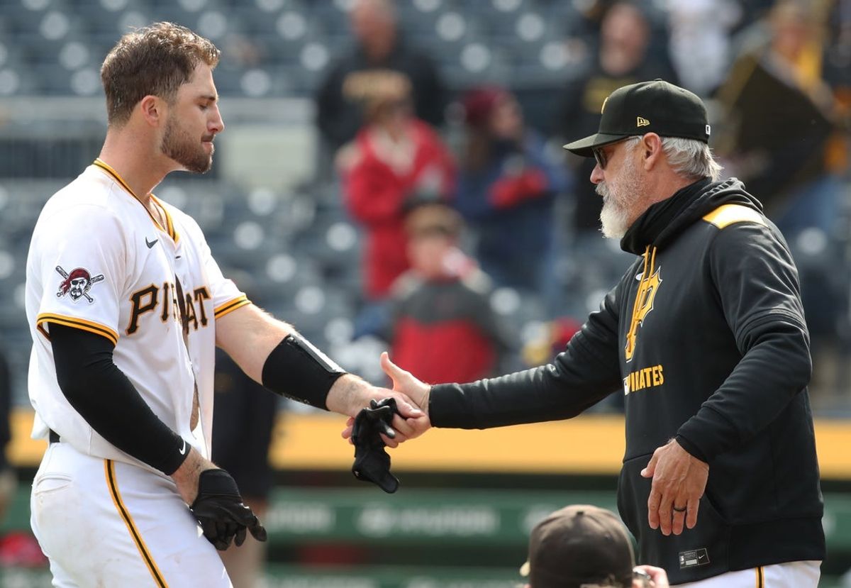 Apr 9, 2025; Pittsburgh, Pennsylvania, USA;  Pittsburgh Pirates catcher Joey Bart (14) and manager Derek Shelton (17) celebrate after Bart hit a game winning walk off single to defeat the St. Louis Cardinals in the thirteenth inning at PNC Park. Mandatory Credit: Charles LeClaire-Imagn Images