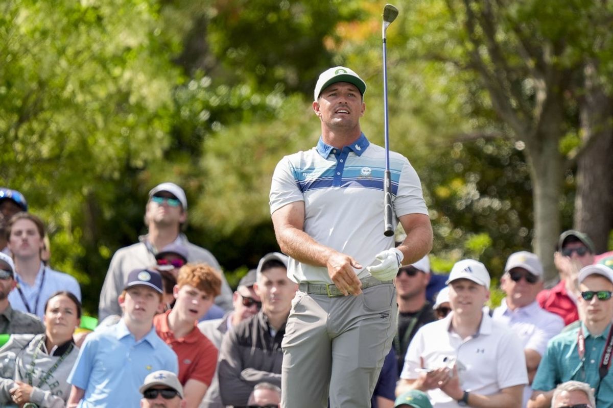 Apr 9, 2025; Augusta, Georgia, USA; Bryson DeChambeau tosses his club after teeing off on no. 3 during the Par 3 Contest at Augusta National Golf Club. Mandatory Credit: Katie Goodale-Imagn Images