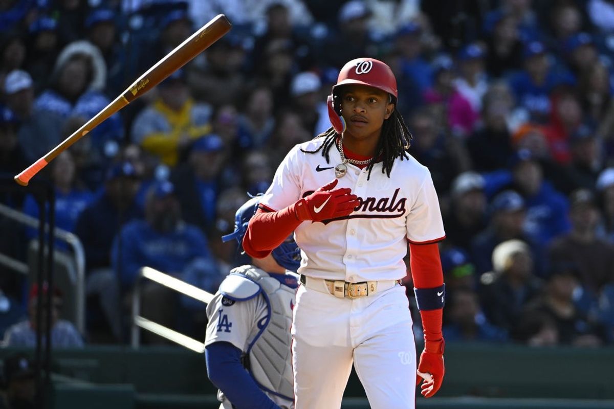 Apr 9, 2025; Washington, District of Columbia, USA; Washington Nationals shortstop CJ Abrams (5) flips his bat after hitting a solo home run against the Los Angeles Dodgers during the first inning at Nationals Park. Mandatory Credit: Brad Mills-Imagn Images