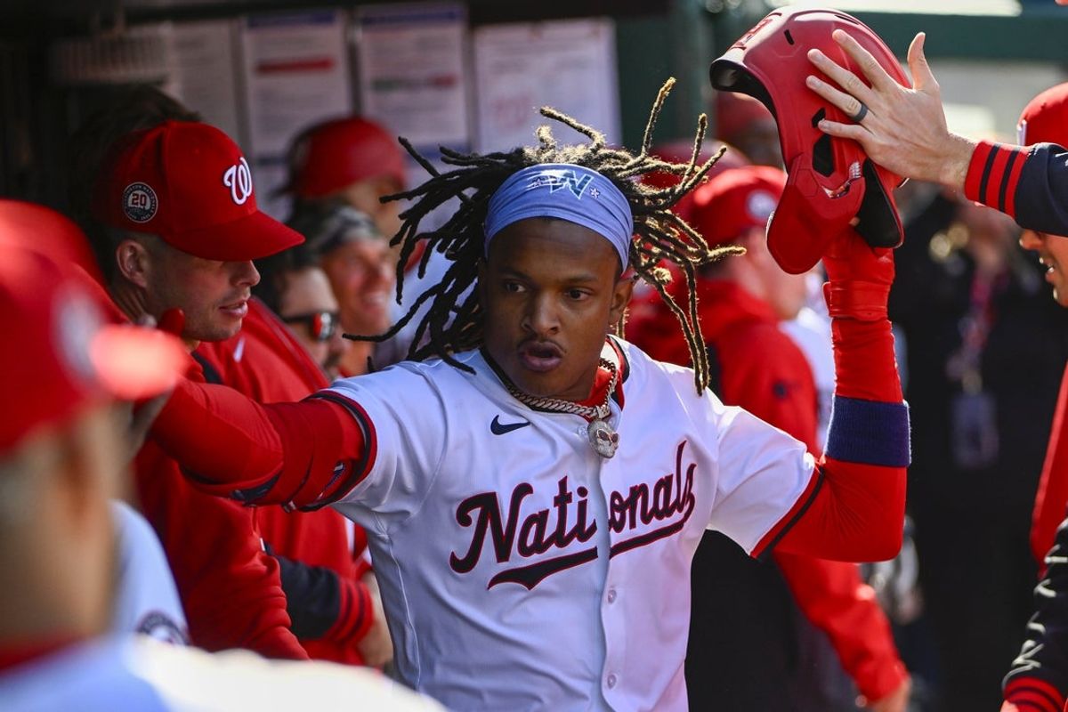 Apr 9, 2025; Washington, District of Columbia, USA; Washington Nationals shortstop CJ Abrams (5) is congratulated by teammates after hitting a solo home run against the Los Angeles Dodgers during the first inning at Nationals Park. Mandatory Credit: Brad Mills-Imagn Images