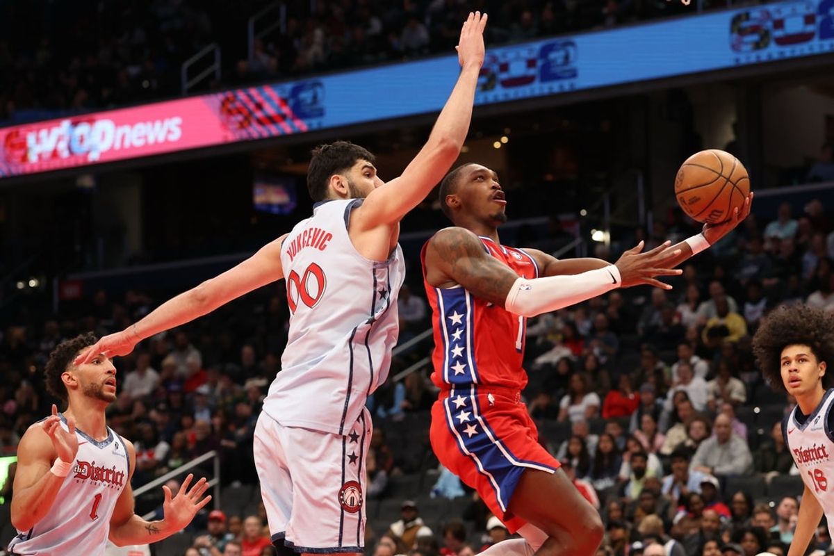 Apr 9, 2025; Washington, District of Columbia, USA; Philadelphia 76ers guard Lonnie Walker IV (16) shoots the ball as Washington Wizards forward Tristan Vukcevic (00) defends in the first half at Capital One Arena. Mandatory Credit: Geoff Burke-Imagn Images