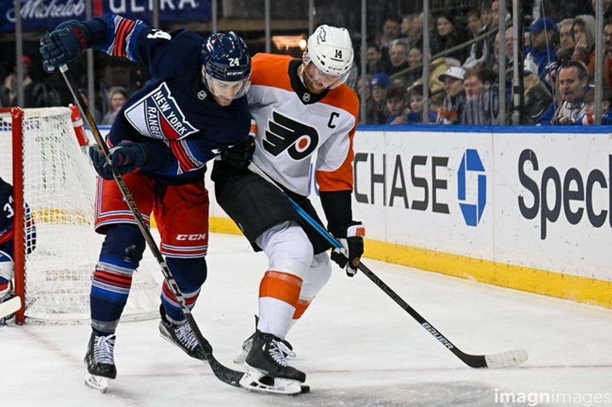 Apr 9, 2025; New York, New York, USA;  New York Rangers defenseman Carson Soucy (24) and Philadelphia Flyers center Sean Couturier (14) battle for the puck during the first period at Madison Square Garden. Mandatory Credit: Dennis Schneidler-Imagn Images