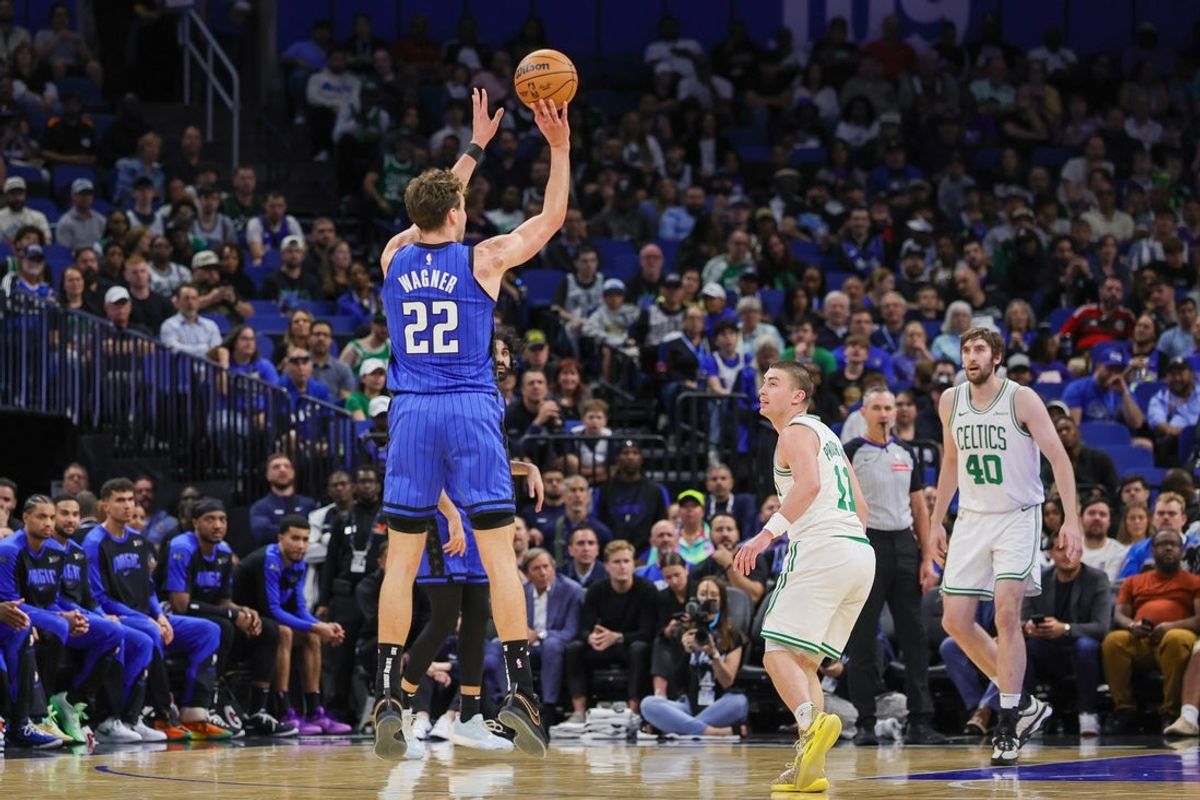 Apr 9, 2025; Orlando, Florida, USA; Orlando Magic forward Franz Wagner (22) shoots a three point basket during the second quarter against the Boston Celtics at Kia Center. Mandatory Credit: Mike Watters-Imagn Images