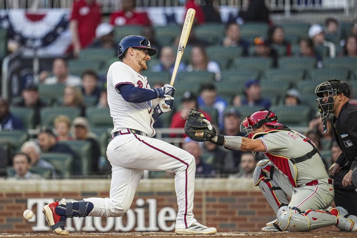 Apr 9, 2025; Cumberland, Georgia, USA; Atlanta Braves catcher Sean Murphy (12) reacts after being hit by a pitch against the Philadelphia Phillies during the second inning at Truist Park. Mandatory Credit: Dale Zanine-Imagn Images