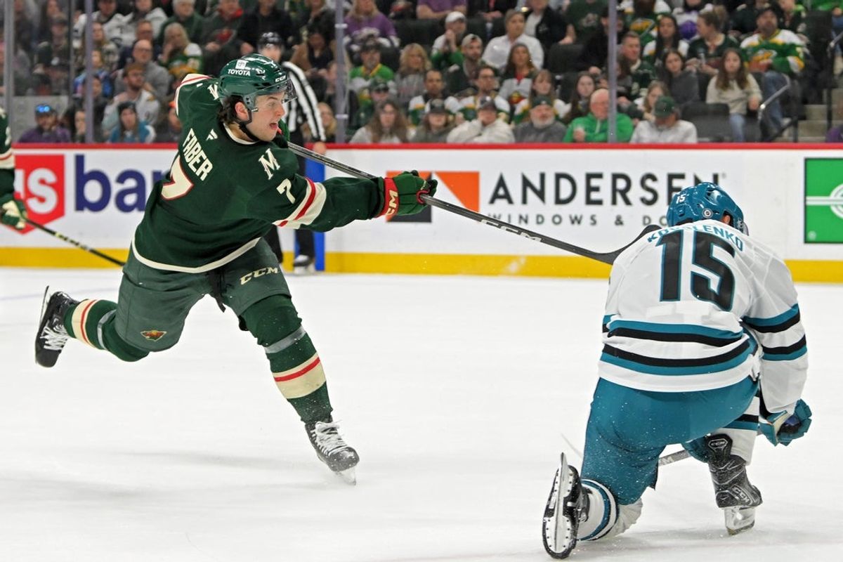 Apr 9, 2025; Saint Paul, Minnesota, USA;  Minnesota Wild defenseman Brock Faber (7) scores against the San Jose Sharks during the first period at Xcel Energy Center. Mandatory Credit: Nick Wosika-Imagn Images