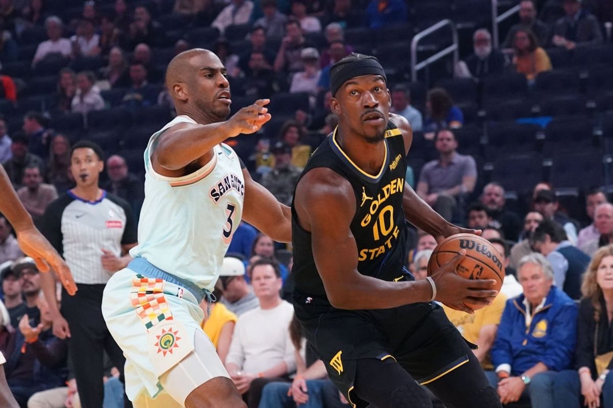 Apr 9, 2025; San Francisco, California, USA;  Golden State Warriors forward Jimmy Butler III (10) dribbles by San Antonio Spurs guard Chris Paul (3) in the first period at Chase Center. Mandatory Credit: David Gonzales-Imagn Images