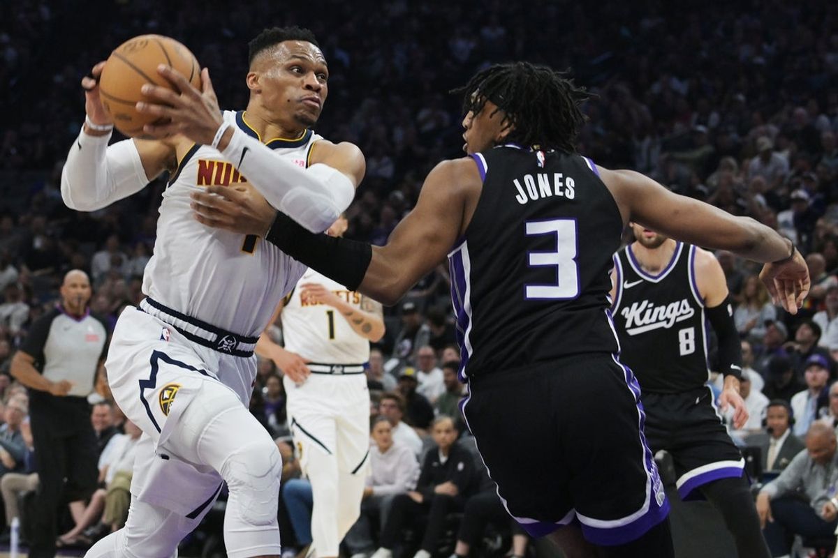 Apr 9, 2025; Sacramento, California, USA; Denver Nuggets guard Russell Westbrook (4) drives to the basket against Sacramento Kings center Isaac Jones (3) during the second quarter at Golden 1 Center. Mandatory Credit: Ed Szczepanski-Imagn Images