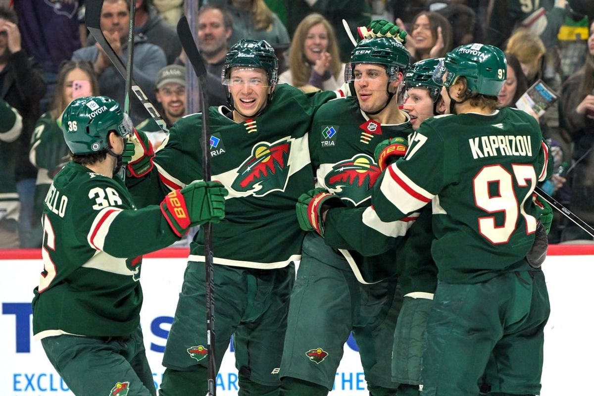 Apr 9, 2025; Saint Paul, Minnesota, USA;  Minnesota Wild forward Joel Eriksson Ek (14) celebrates with forward Mats Zuccarello (36), forward Joel Eriksson Ek (14), forward Marco Rossi (23) and forward Kiril Kaprizov (97) after completing a hat trick on a power play goal against the San Jose Sharks during the third period at Xcel Energy Center. Mandatory Credit: Nick Wosika-Imagn Images