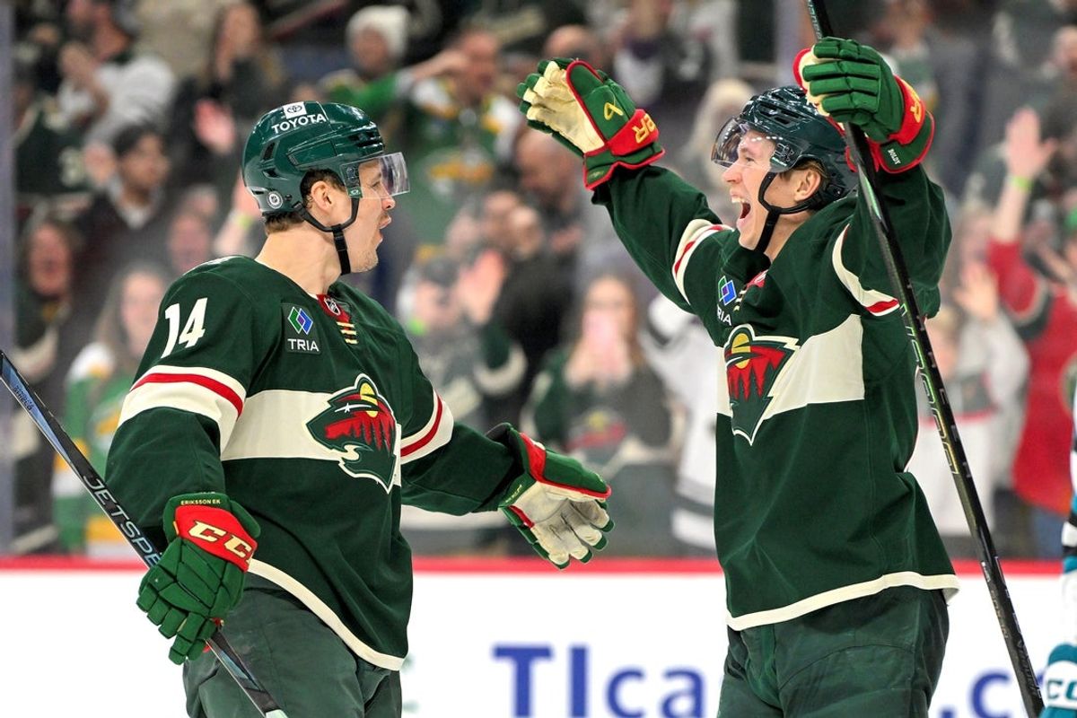 Apr 9, 2025; Saint Paul, Minnesota, USA;  Minnesota Wild forward Joel Eriksson Ek (14) celebrates his fourth goal of the night against the San Jose Sharks with forward Matt Boldy (12) during the third period at Xcel Energy Center. Mandatory Credit: Nick Wosika-Imagn Images
