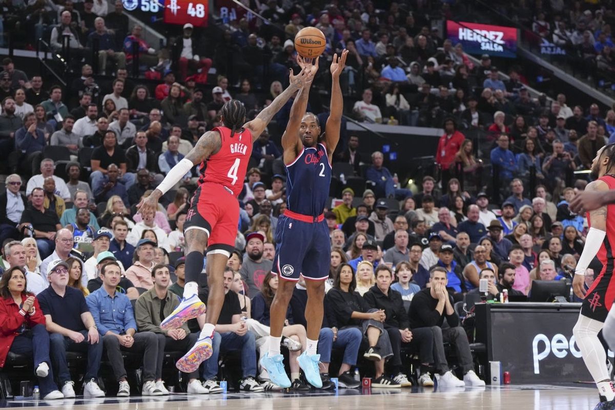 Apr 9, 2025; Inglewood, California, USA; Los Angeles Clippers guard Kawhi Leonard (2) shoots against Houston Rockets guard Jalen Green (4) in the first half at Intuit Dome. Mandatory Credit: Kirby Lee-Imagn Images