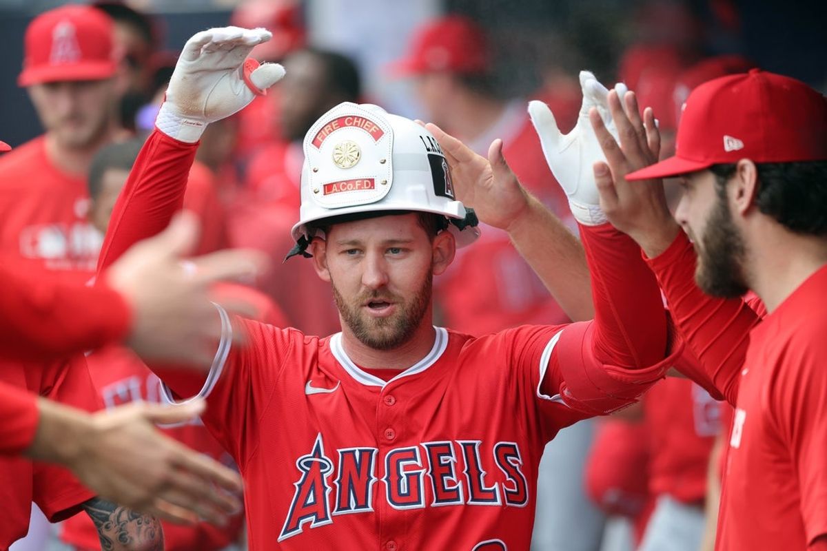Apr 10, 2025; Tampa, Fl, USA; Los Angeles Angels outfielder Taylor Ward (3) is congratulated in the dugout after he hit a home run against the Tampa Bay Rays during the first inning  at George M. Steinbrenner Field. Mandatory Credit: Kim Klement Neitzel-Imagn Images