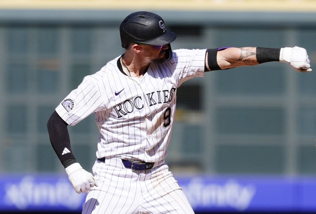 Apr 10, 2025; Denver, Colorado, USA; Colorado Rockies outfielder Brenton Doyle (9) reacts after a two run double against the Milwaukee Brewers  at Coors Field. Mandatory Credit: Ron Chenoy-Imagn Images