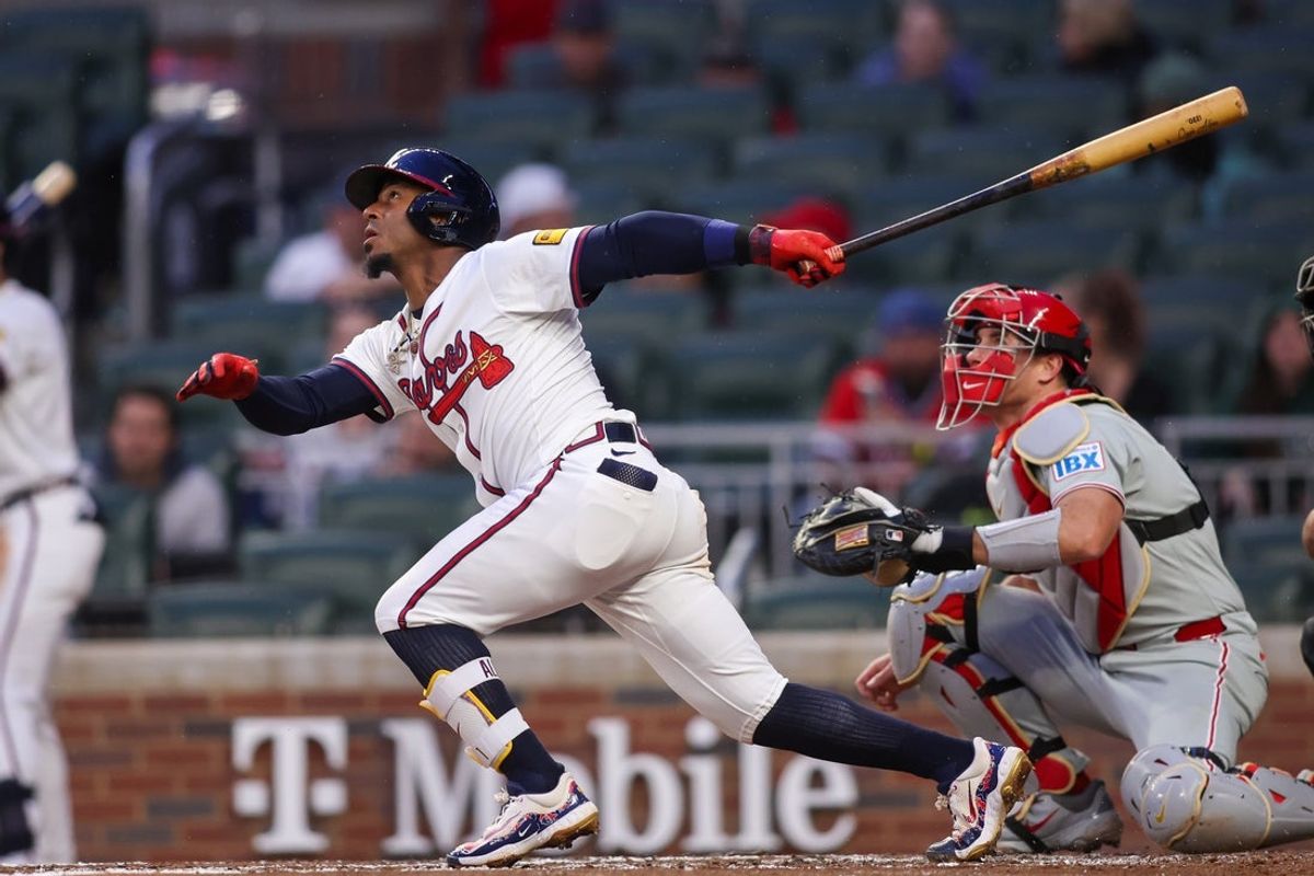 Apr 10, 2025; Atlanta, Georgia, USA; Atlanta Braves second baseman Ozzie Albies (1) hits a single against the Philadelphia Phillies in the third inning at Truist Park. Mandatory Credit: Brett Davis-Imagn Images