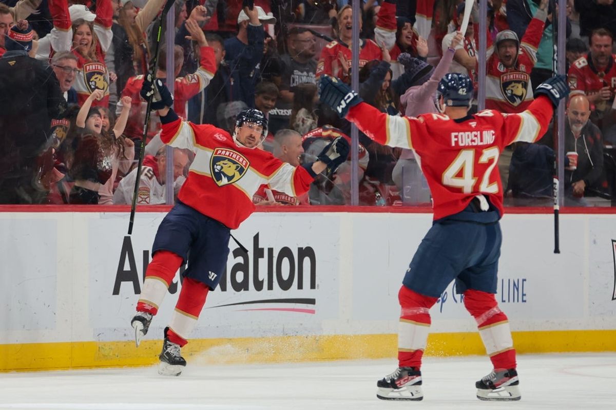 Apr 10, 2025; Sunrise, Florida, USA; Florida Panthers center Brad Marchand (63) celebrates with defenseman Gustav Forsling (42) after scoring against the Detroit Red Wings during the second period at Amerant Bank Arena. Mandatory Credit: Sam Navarro-Imagn Images
