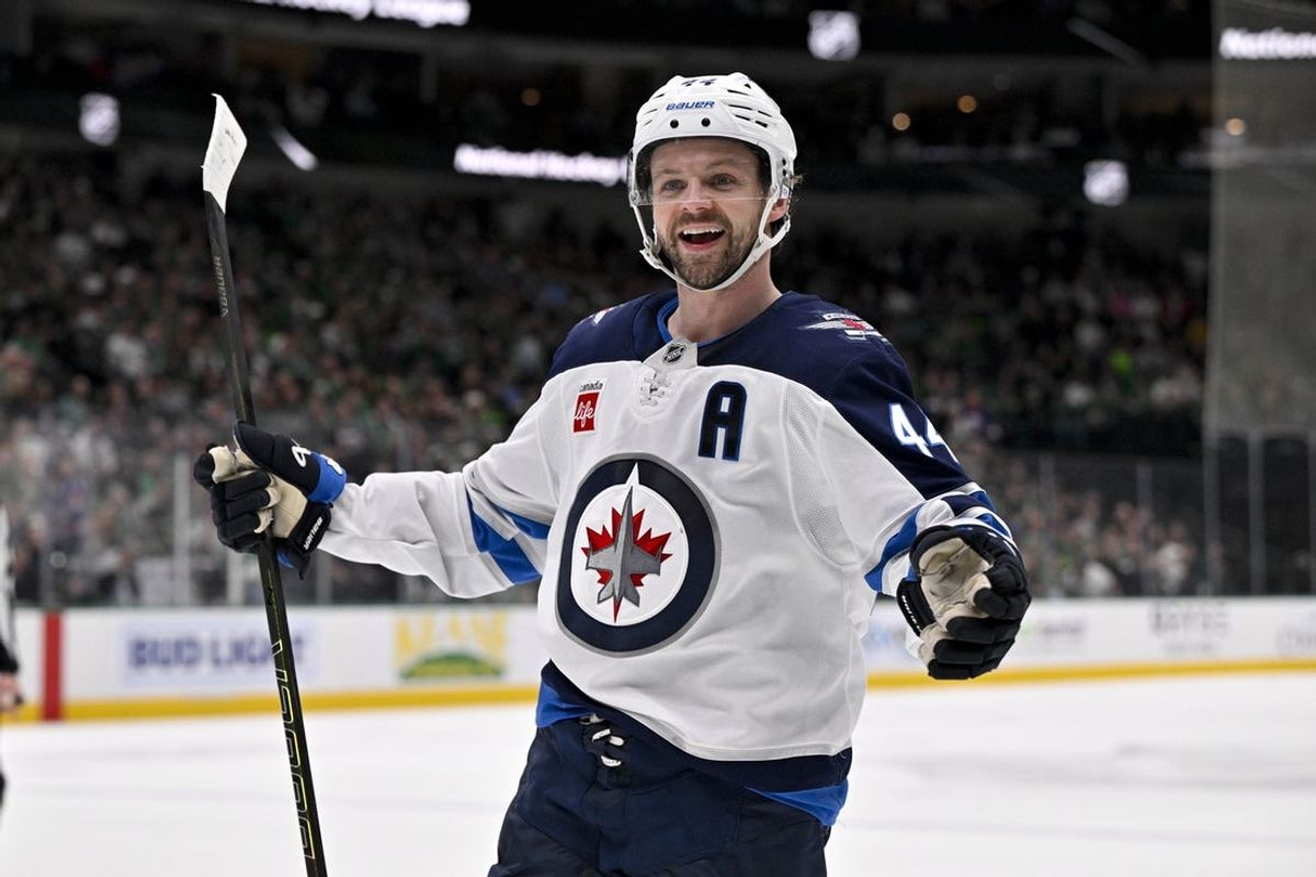 Apr 10, 2025; Dallas, Texas, USA; Winnipeg Jets defenseman Josh Morrissey (44) celebrates a goal scored by right wing Nino Niederreiter (not pictured) against the Dallas Stars during the first period at the American Airlines Center. Mandatory Credit: Jerome Miron-Imagn Images
