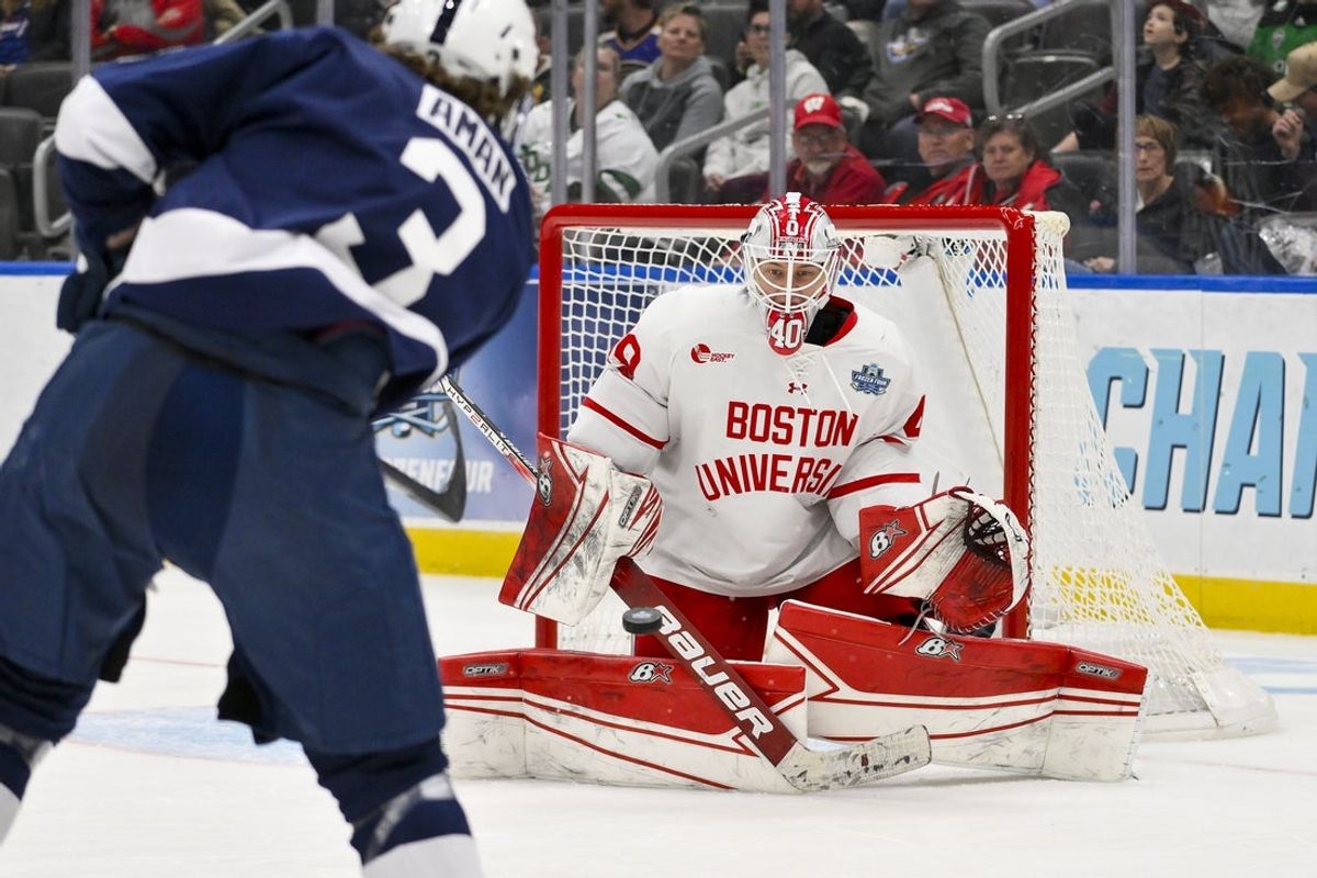 Apr 10, 2025; St. Louis, Missouri, UNITED STATES; Boston University Terriers goaltender Mikhail Yegorov (40) defends the net against Penn State Nittany Lions defenseman Casey Aman (3) during the first period of the Frozen Four college ice hockey national semifinals at Enterprise Center. Mandatory Credit: Jeff Curry-Imagn Images