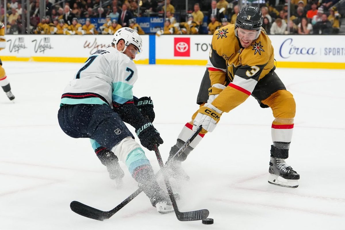 Apr 10, 2025; Las Vegas, Nevada, USA; Vegas Golden Knights defenseman Brayden McNabb (3) attempts to block a pass to Seattle Kraken right wing Jordan Eberle (7) during the first period at T-Mobile Arena. Mandatory Credit: Stephen R. Sylvanie-Imagn Images