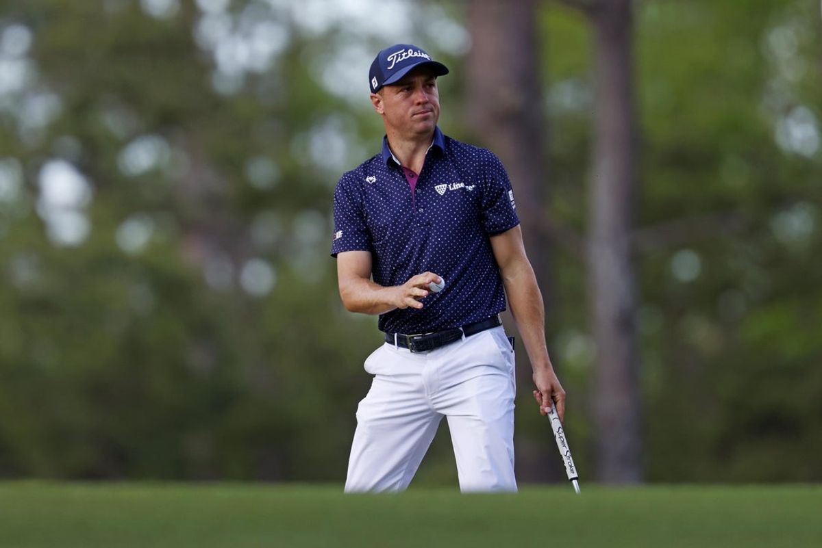 Apr 11, 2025; Augusta, Georgia, USA; Justin Thomas waves to the patrons after making a putt on the 14th green during the second round of the Masters Tournament at Augusta National Golf Club. Mandatory Credit: Peter Casey-Imagn Images