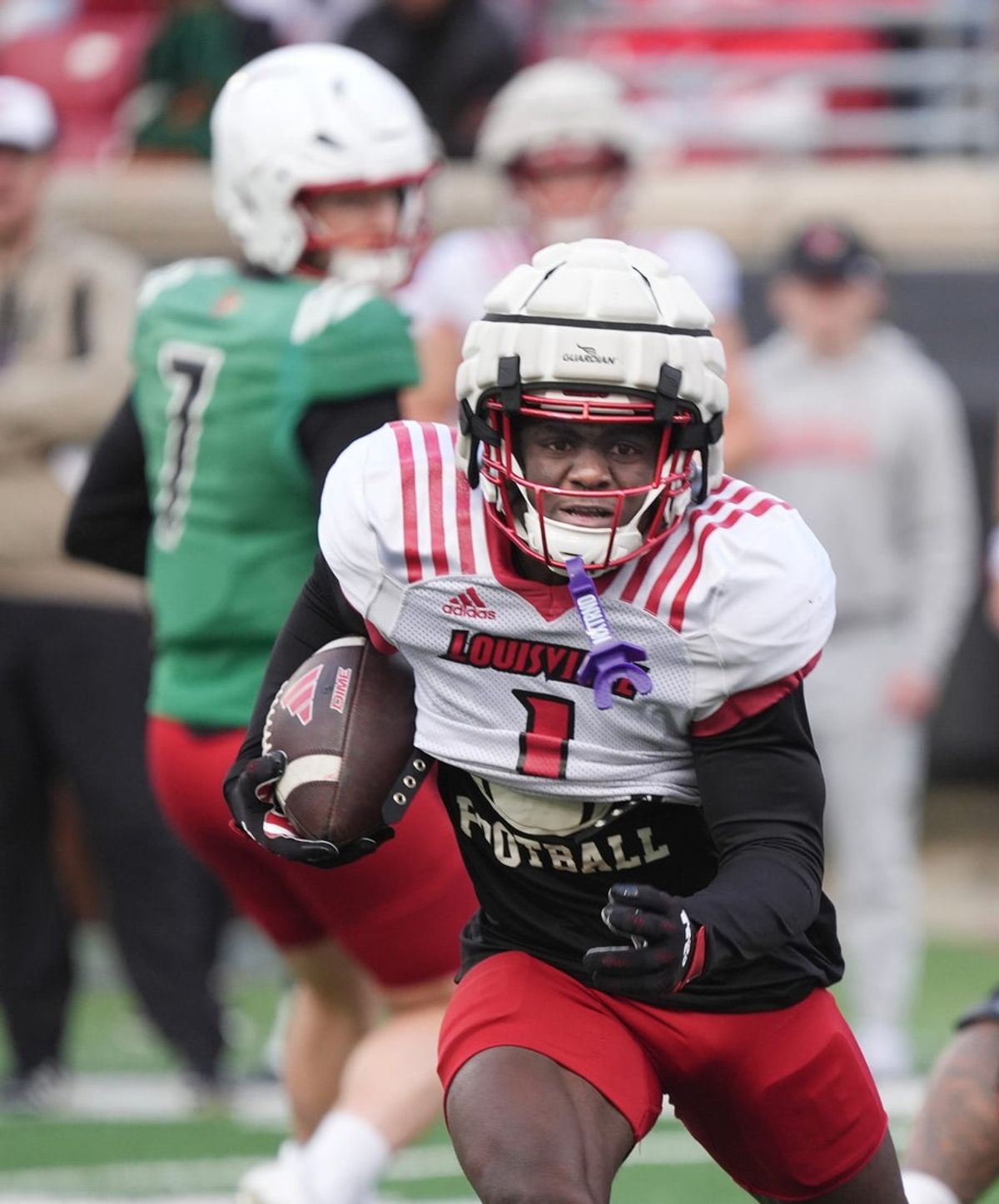 Louisville Isaac Brown (1) runs for a first down against Red Louisville in the Spring Game Friday night at L & N Stadium.
April 11, 2025