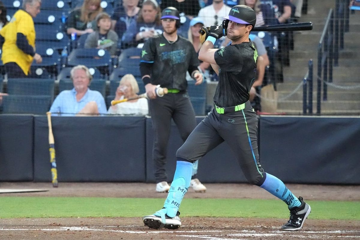 Apr 11, 2025; Tampa, Florida, USA; Tampa Bay Rays outfielder Kameron Misner (26) hits a double against the Atlanta Braves during the second inning at George M. Steinbrenner Field. Mandatory Credit: Dave Nelson-Imagn Images