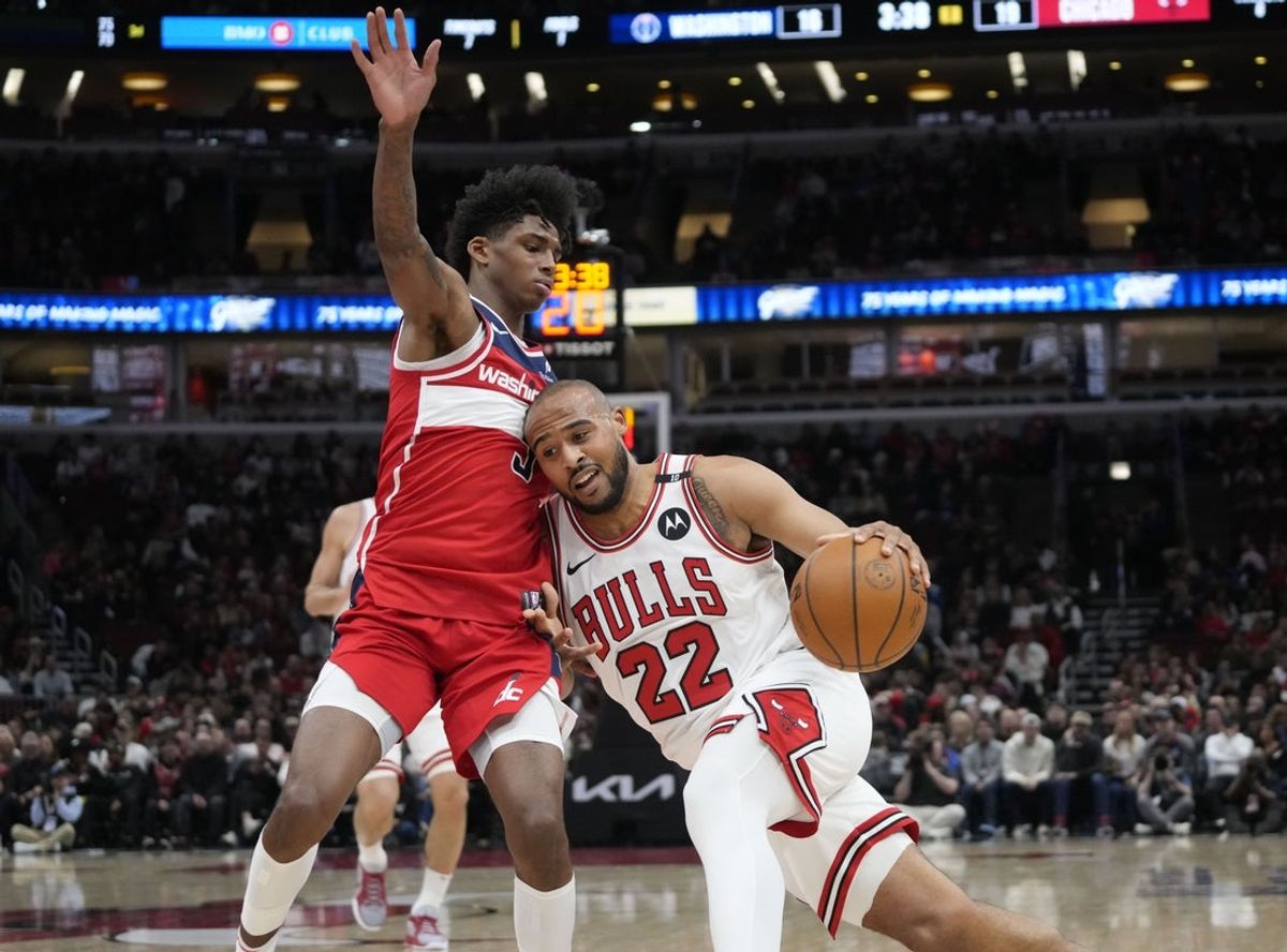 Apr 11, 2025; Chicago, Illinois, USA; Washington Wizards guard AJ Johnson (5) defends Chicago Bulls forward Talen Horton-Tucker (22) during the first quarter at United Center. Mandatory Credit: David Banks-Imagn Images
