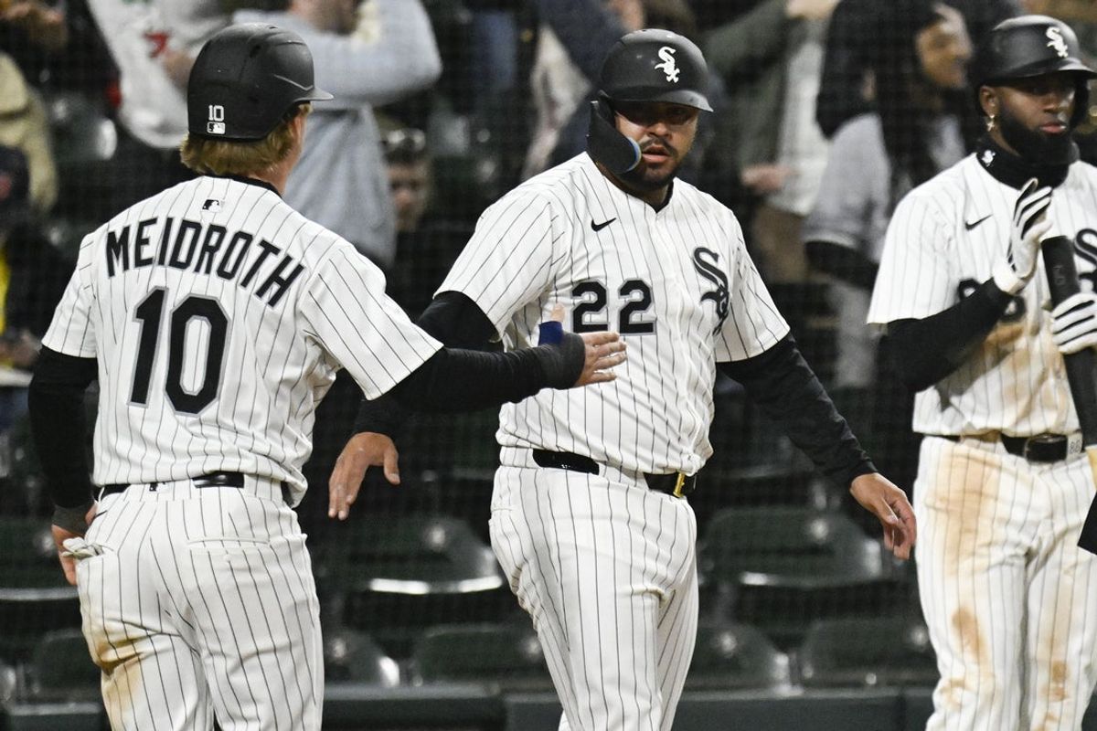 Apr 11, 2025; Chicago, Illinois, USA; Chicago White Sox catcher Omar Narváez (22) and second baseman Chase Meidroth (10) celebrate after they score against the Boston Red Sox during the fourth inning at Guaranteed Rate Field. Mandatory Credit: Matt Marton-Imagn Images