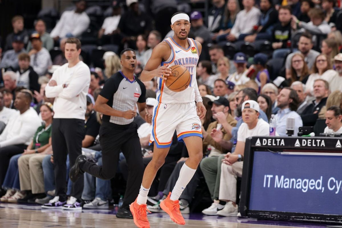 Apr 11, 2025; Salt Lake City, Utah, USA;  Oklahoma City Thunder guard Aaron Wiggins (21) brings the ball up the court during the first quarter against the Utah Jazz at Delta Center. Mandatory Credit: Chris Nicoll-Imagn Images