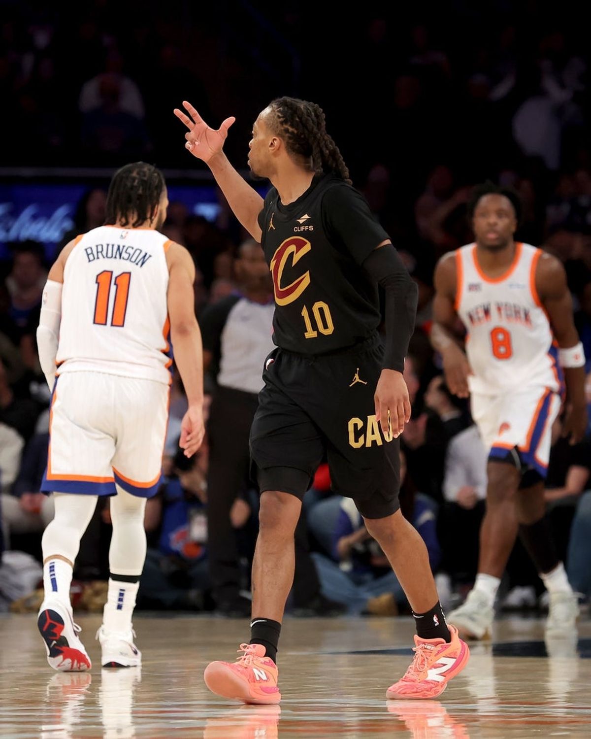 Apr 11, 2025; New York, New York, USA; Cleveland Cavaliers guard Darius Garland (10) celebrates his three point shot against New York Knicks guard Jalen Brunson (11) and forward OG Anunoby (8) during the fourth quarter at Madison Square Garden. Mandatory Credit: Brad Penner-Imagn Images