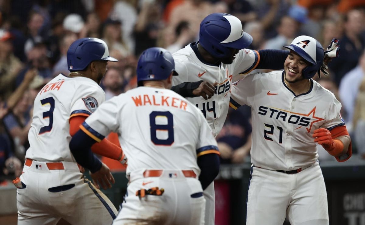 Apr 11, 2025; Houston, Texas, USA; Houston Astros catcher Yainer Diaz (21) celebrates a grand slam with teammates against the Los Angeles Angels  in the fifth inning at Daikin Park. Mandatory Credit: Thomas Shea-Imagn Images