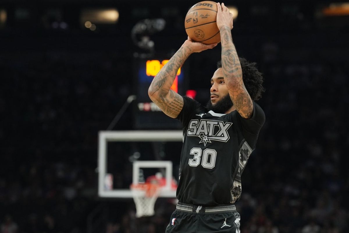 Apr 11, 2025; Phoenix, Arizona, USA; San Antonio Spurs forward Julian Champagnie (30) shoots against the Phoenix Suns during the first half at Footprint Center. Mandatory Credit: Joe Camporeale-Imagn Images