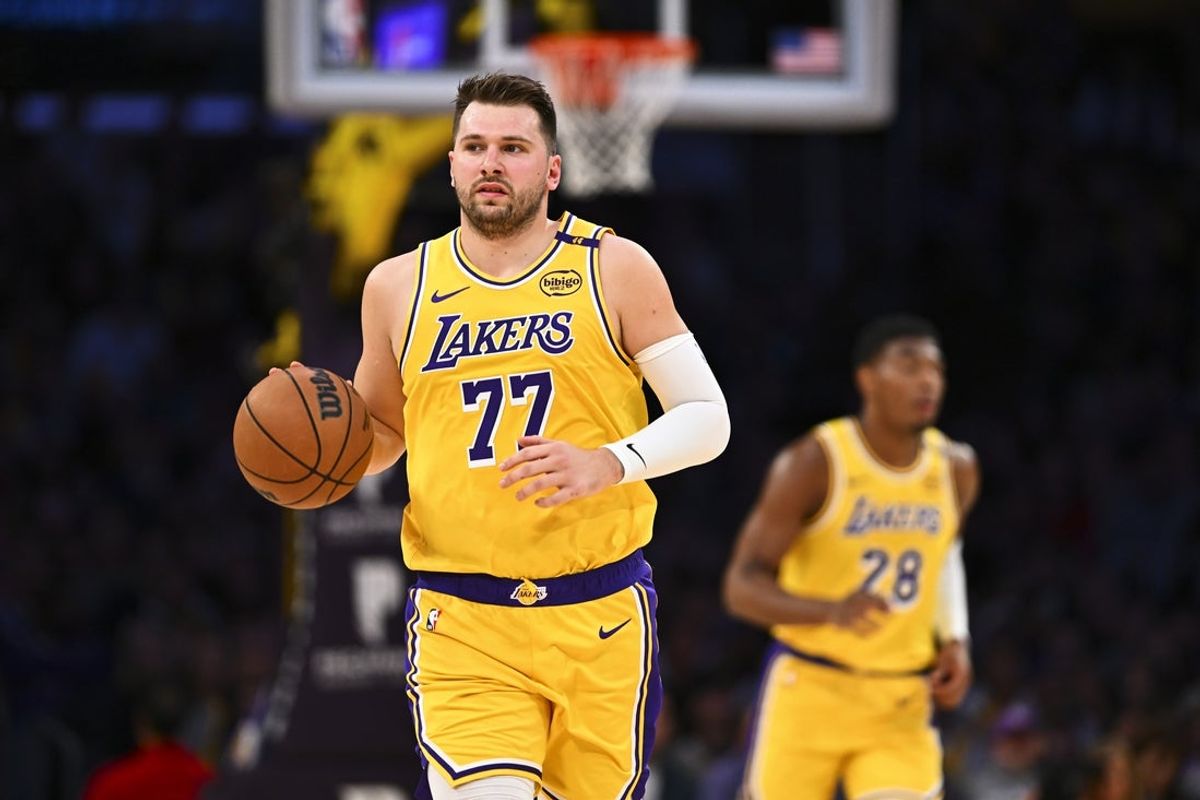 Apr 11, 2025; Los Angeles, California, USA; Los Angeles Lakers guard Luka Doncic (77) moves the ball against the Houston Rockets during the first half at Crypto.com Arena. Mandatory Credit: Jonathan Hui-Imagn Images