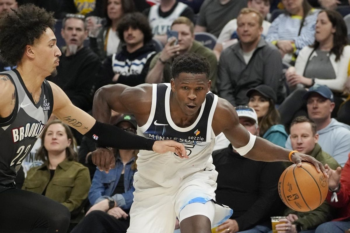 Apr 11, 2025; Minneapolis, Minnesota, USA; Minnesota Timberwolves guard Anthony Edwards (5) works around Brooklyn Nets forward Jalen Wilson (22) in the third quarter at Target Center. Mandatory Credit: Bruce Kluckhohn-Imagn Images