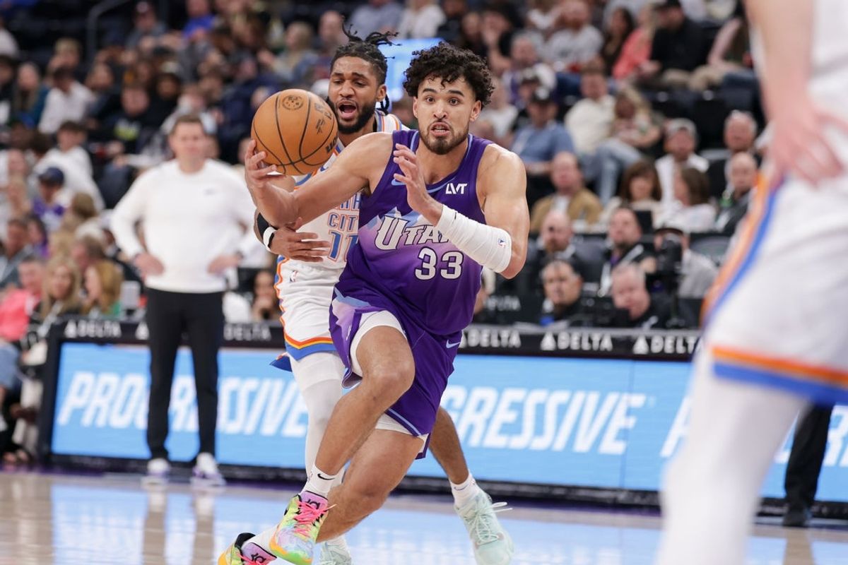Apr 11, 2025; Salt Lake City, Utah, USA;  Utah Jazz guard Johnny Juzang (33) drives to the basket during the second half against the Oklahoma City Thunder at Delta Center. Mandatory Credit: Chris Nicoll-Imagn Images