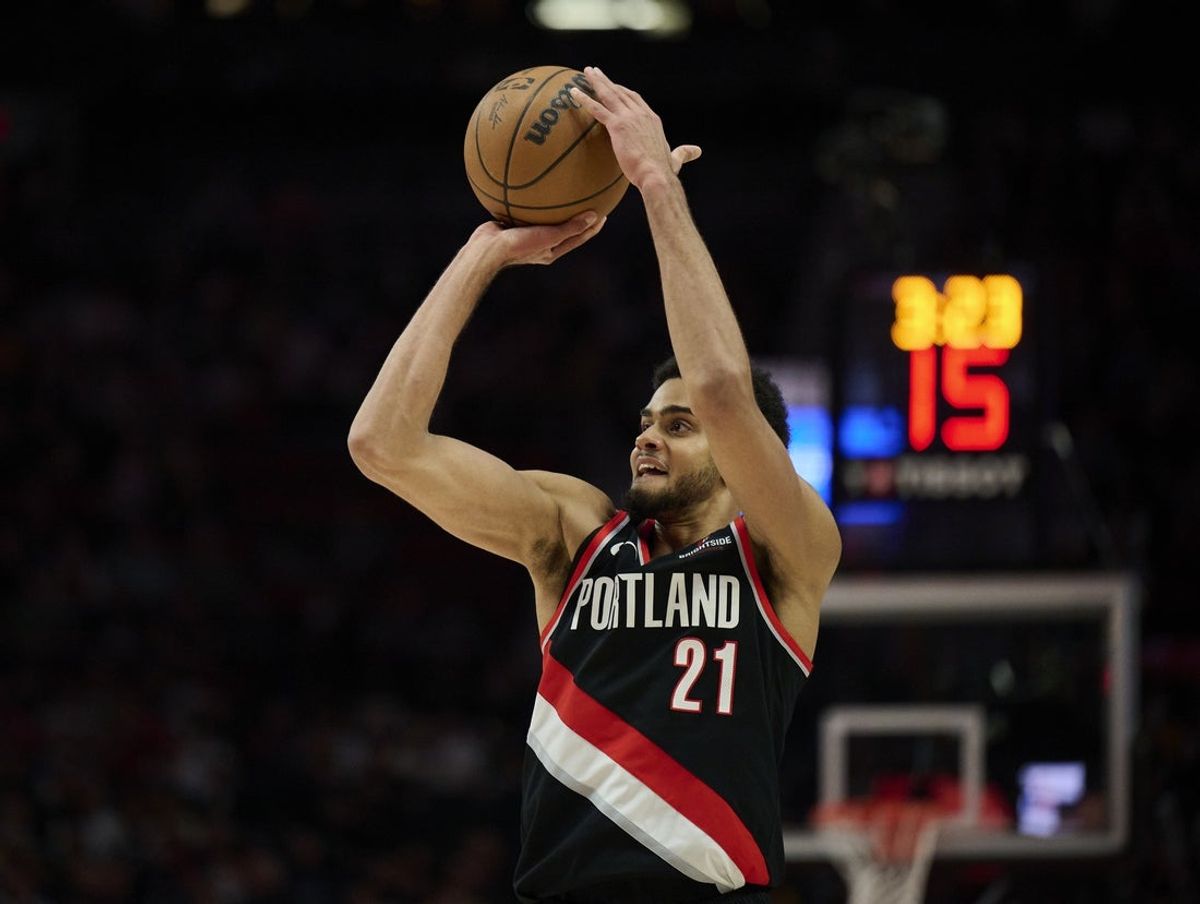 Apr 11, 2025; Portland, Oregon, USA; Portland Trail Blazers guard Rayan Rupert (21) shoots a jumps shot during the second half against the Golden State Warriors at Moda Center. Mandatory Credit: Troy Wayrynen-Imagn Images