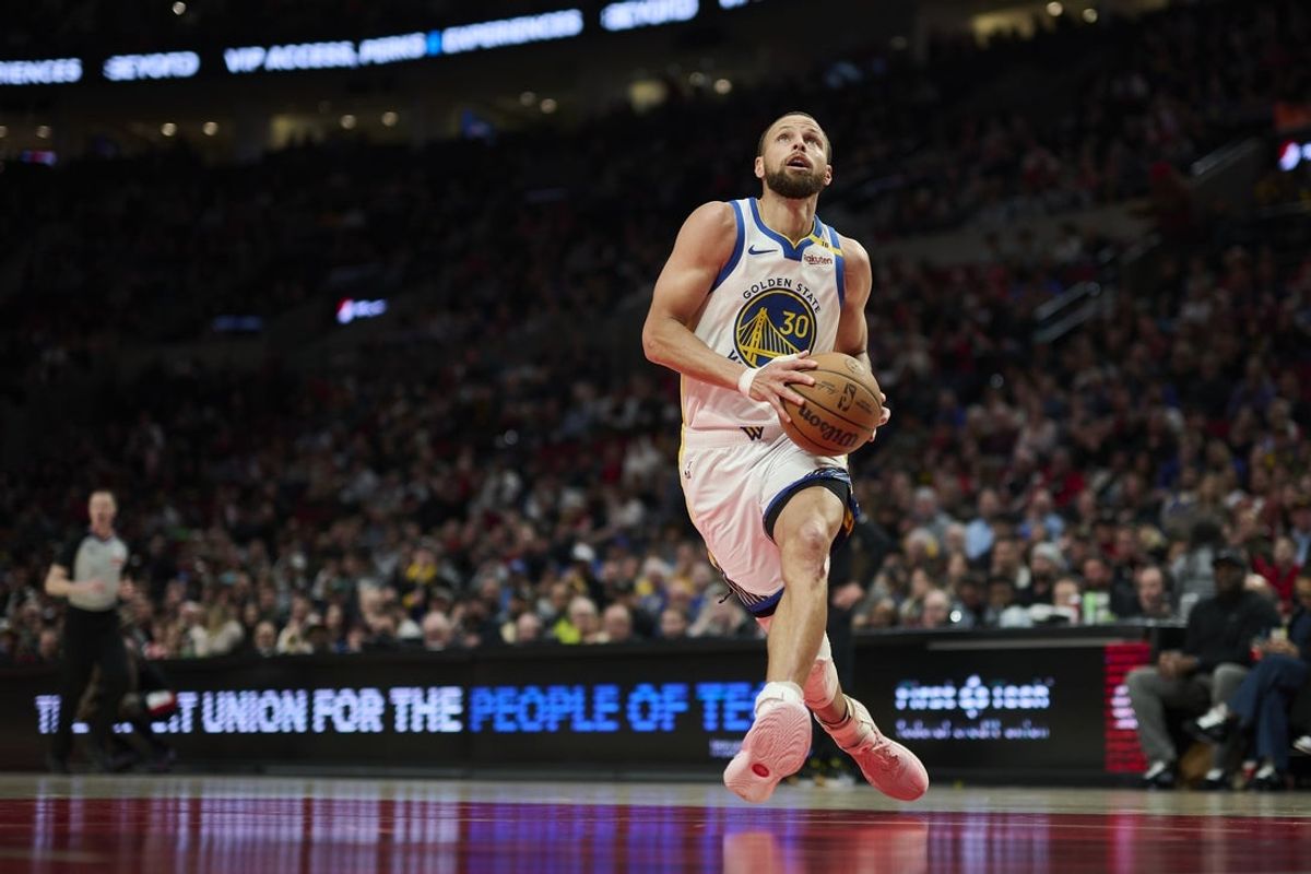 Apr 11, 2025; Portland, Oregon, USA; Golden State Warriors guard Stephen Curry (30) scores on a fast break during the second half against the Portland Trail Blazers at Moda Center. Mandatory Credit: Troy Wayrynen-Imagn Images